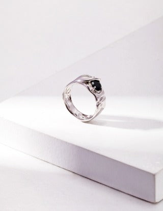 A pure silver synthetic spinel ring