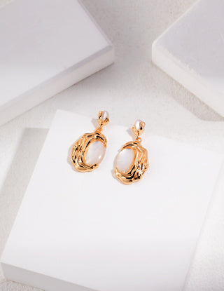 Irregularly patterned natural mother-of-pearl series with cooled lava Sterling silver earrings
