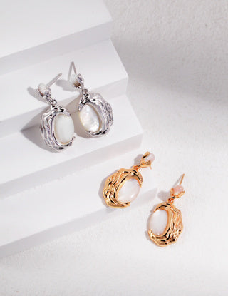 Irregularly patterned natural mother-of-pearl series with cooled lava Sterling silver earrings