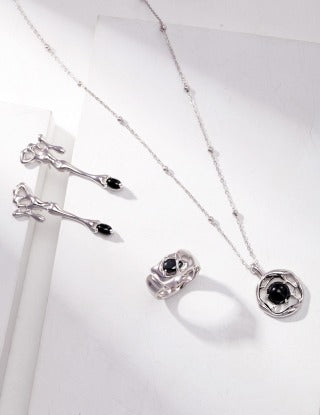 A pure silver synthetic spinel ring